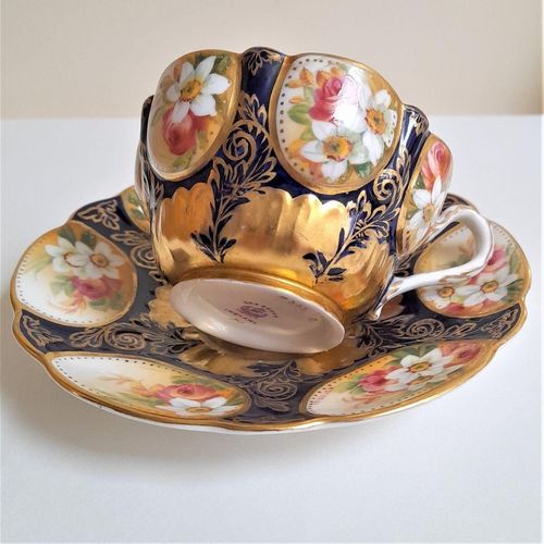 Underside of cup sat on the saucer