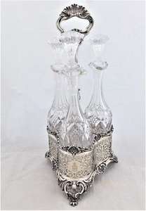 Set of Three Cut Glass Decanters or Serving Bottles on Silver Plated Stand Victorian c 1860
