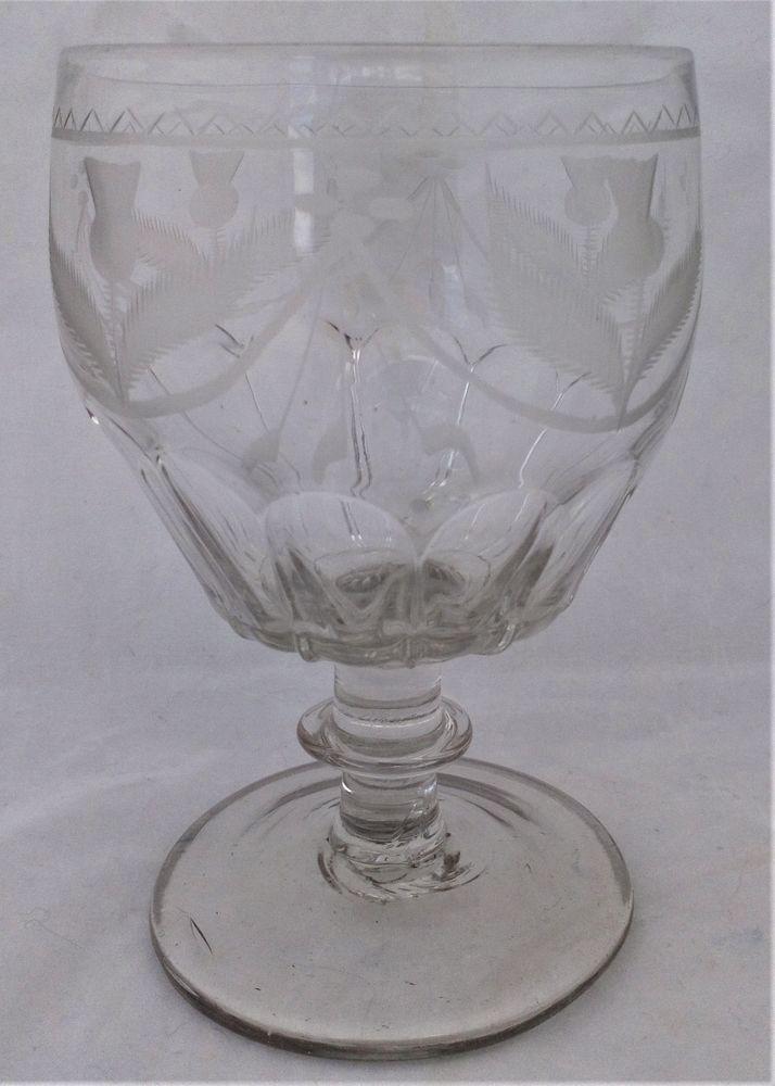 Antique Georgian petal moulded glass rummer engraved thistles and swags barrel bowl blade knop stem and plain conical foot circa 1800.