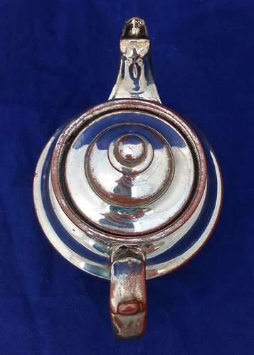 Victorian antique platinum lustre teapot with a shouldered round body on a pedestal foot and with a low collar, it is bachelor sized circa 1840