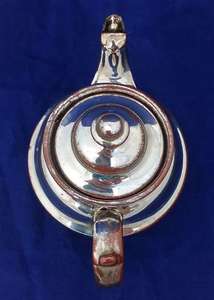 Victorian antique platinum lustre teapot with a shouldered round body on a pedestal foot and with a low collar, it is bachelor sized circa 1840