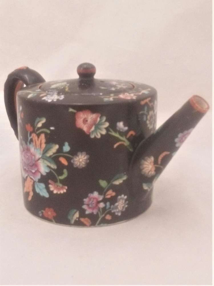 Antique Davenport transferware cylindrical teapot  decorated with the Chrysanthemum Floral Spray pattern on a black ground circa 1860