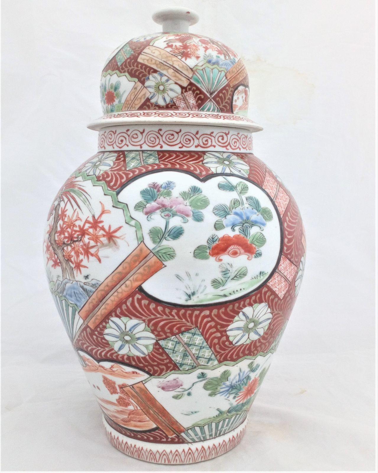 A large antique Japanese Hizen porcelain vase and cover marked Zoshuntei Saiho. Decorated in hand painted enamels with two large Japanese folding fans each painted with a colourful Asiatic Pheasant flying over a Japanese Acer.  This antique temple vase and cover dates from the mid 19th century circa 1860.