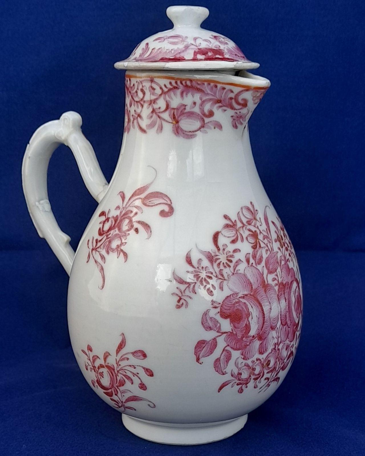 An antique Chinese porcelain lidded sparrow beak milk jug or creamer hand painted in puce with a floral pattern made in theperiod of the Chinese Emperor Qianlong in the Qing dynasty  circa 1760
