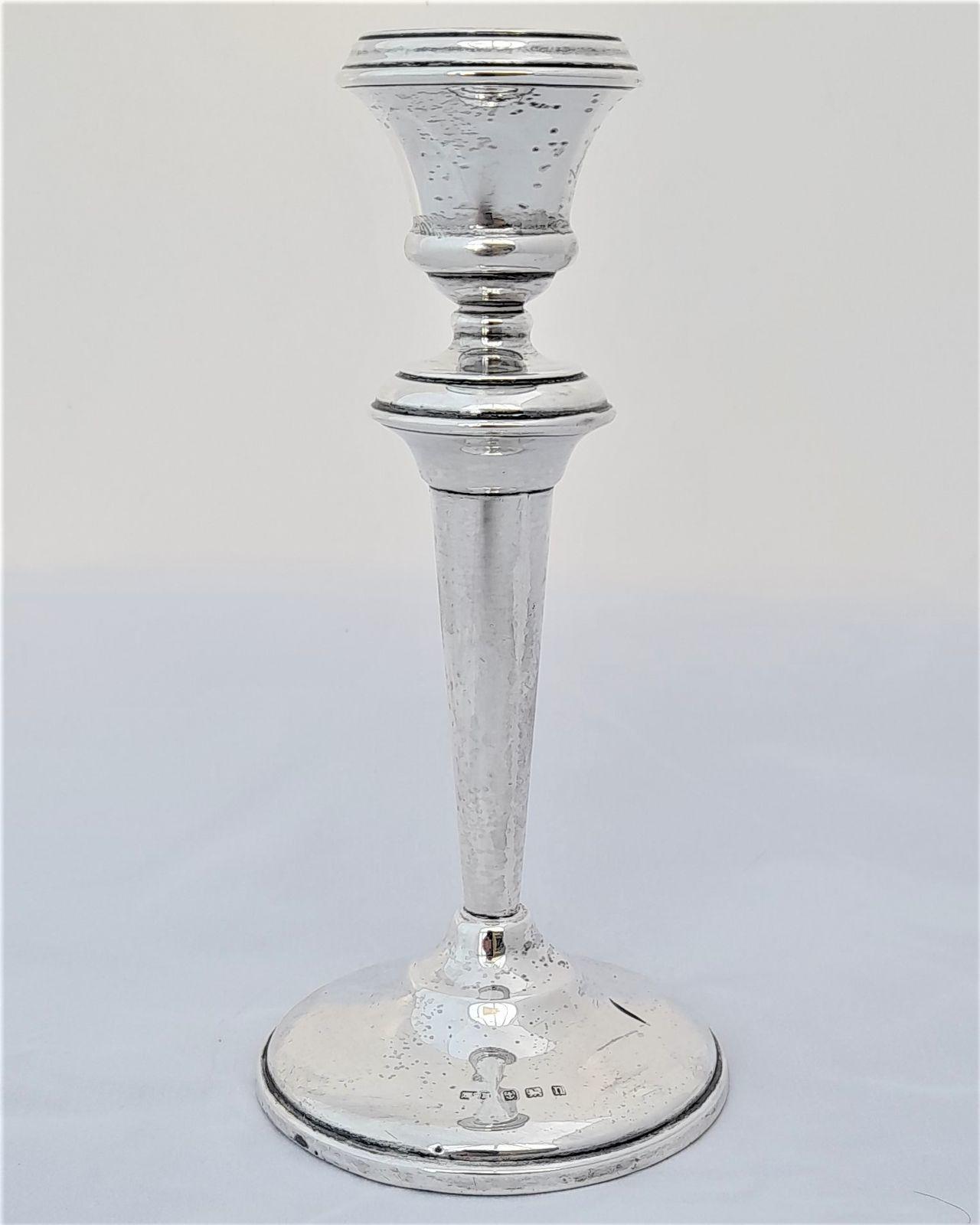 An antique Sterling silver candlestick Georgian style hallmarked with the anchor for Birmingham n for 1912 HSM for Herbert Scott Murdoch 14.2 cm high