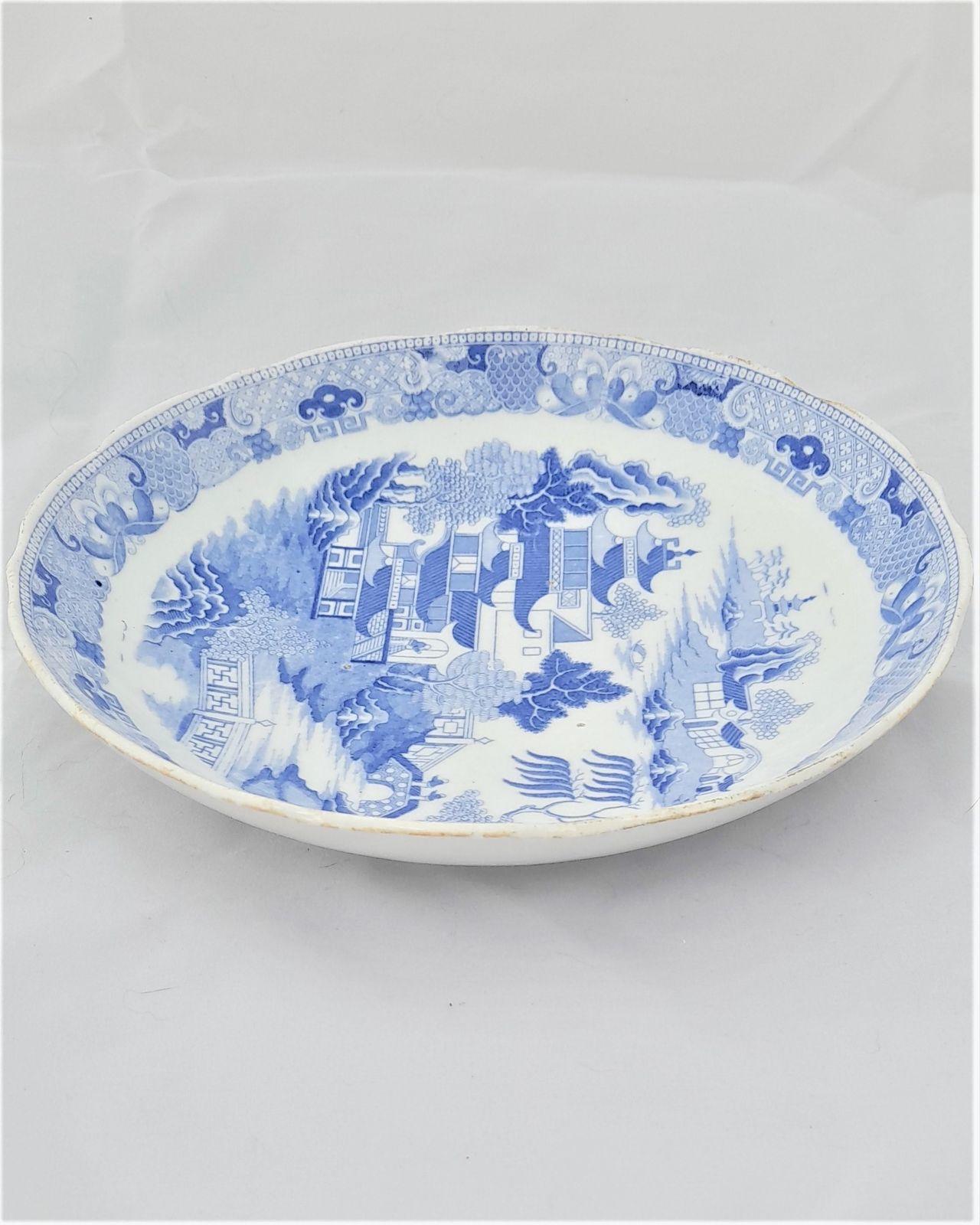 An antique Miles Mason type porcelain saucer dish transfer printed in blue and white in the Two Temples Broseley pattern circa 1810