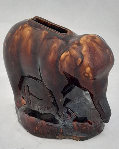 An antique novelty pottery elephant money box with a Rockingham type brown treacle glaze dates to the early 19th century - piggy bank in the form of a Jumbo elephant circa 1830 10. 3 cm high 12.6 cm long
