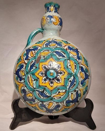 Moroccan tin glazed earthenware or faience pilgrim water flask antique 19th century hand painted with polychrome Arabesque foliate geometric pattern  727 grammes  9 inches long 6.5 inches wide  3 5/8 inches deep