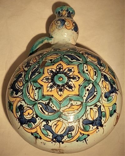 Moroccan tin glazed earthenware or faience pilgrim water flask antique 19th century hand painted with polychrome Arabesque foliate geometric pattern  727 grammes  9 inches long 6.5 inches wide  3 5/8 inches deep