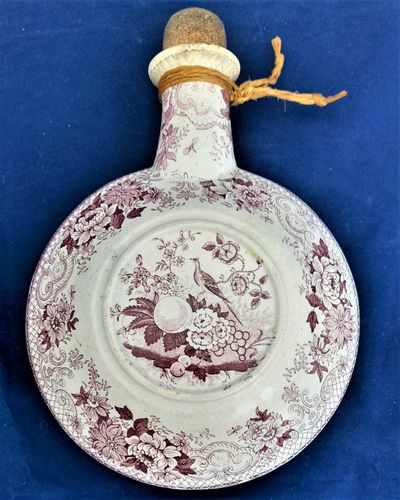 Antique Pearlware Transferware Spirit Flask Purple Printed with a Bird & Floral Fruit Pattern Antique circa 1835 sometimes called a Pilgrim Flask - possibly Persian Pattern variation from a Yorkshire Pottery. 1 pint capacity,  19 cm long, 335 grammes unpacked.