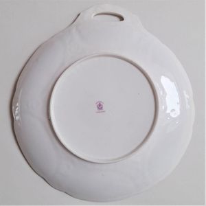 Underside of a cake plate