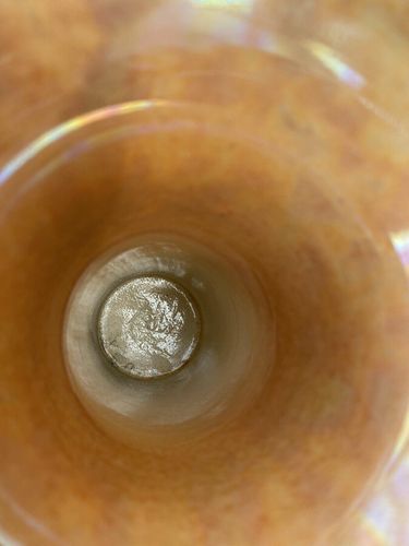 Detail view of incised mark inside the vase