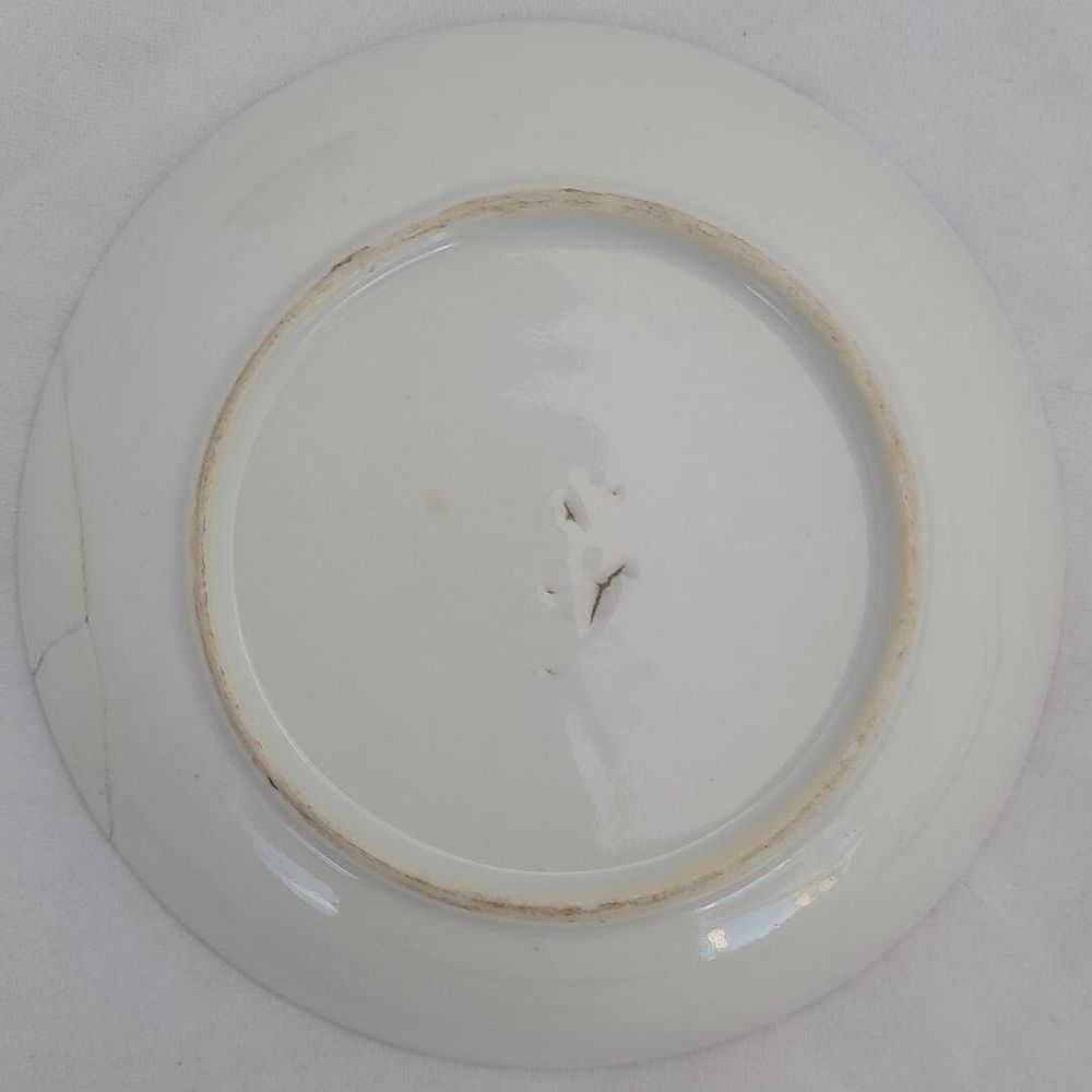Underside of saucer with view of break