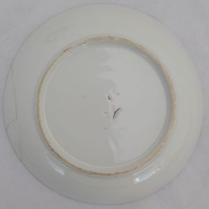 Underside of saucer with view of break