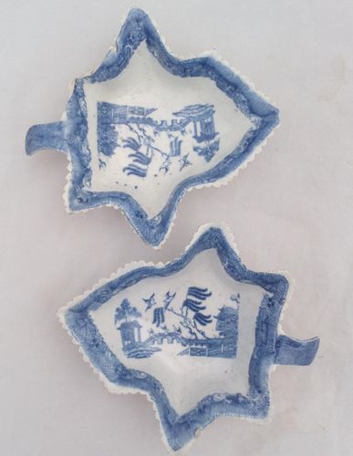 Pair antique Minton pearlware pottery leaf shaped pickle dishes decorated in blue and white transferware standard willow pattern circa 1800.