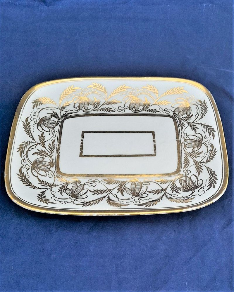 An antique Thomas Rose Coalport London shaped hybrid hard paste porcelain tea pot stand gilded pattern 1149 dating from the Regency period circa 1812.