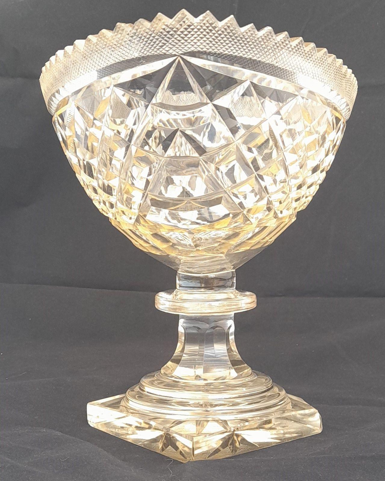 Large boat or canoe shaped cut glass pedestal bowl set on a diamond shaped cut base. In a Georgian style but late 19th century circa 1890 33.5 cm long 18 cm wide 22 cm high  weighs 2.9 Kg unpacked.