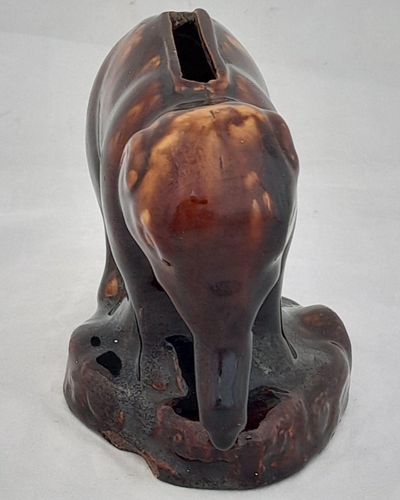 An antique novelty pottery elephant money box with a Rockingham type brown treacle glaze dates to the early 19th century - piggy bank in the form of a Jumbo elephant circa 1830 10. 3 cm high 12.6 cm long