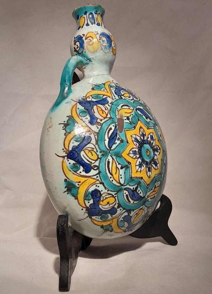 Moroccan tin glazed earthenware or faience pilgrim water flask antique 19th century hand painted with polychrome Arabesque foliate geometric pattern  727 grammes  9 inches long 6.5 inches wide  3 5/8 inches deep