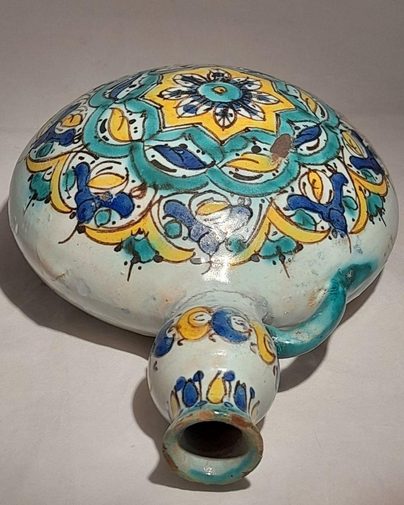 Moroccan tin glazed earthenware or faience pilgrim water flask antique 19th century hand painted with polychrome Arabesque foliate geometric pattern  727 grammes  9 inches long 6.5 inches wide  3 5/8 inches deep
