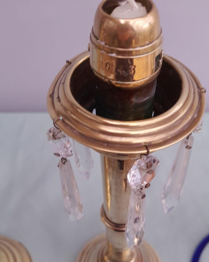 Pair of antique brass spring loaded hurricane candlesticks with grapevine etched glass shades with blue rim & cut glass prism lustre droppers 53 cm High 3.8 kg
