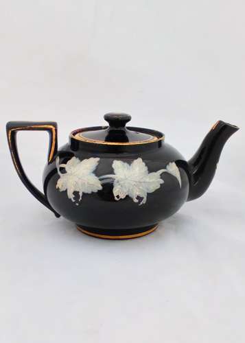 Victorian black glazed teapot with white enamelled vine leaves and stems antique circa 1850