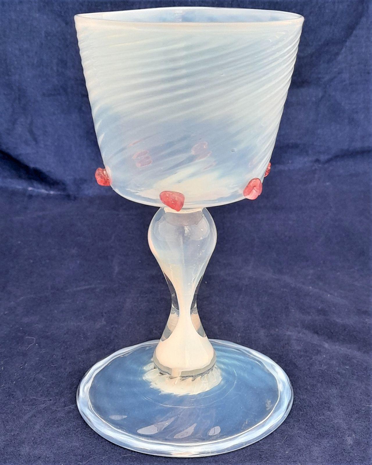 Antique Antonio Salviati & Co Façon de Venise Wrythen Fluted Opal Wine Glass circa 1880.  The wrythen fluted bucket shaped bowl with six applied red prunts, all on a hollow hour glass opal stem, on a wrythen fluted folded foot with a rough pontil. Some typical minor surface wear.
