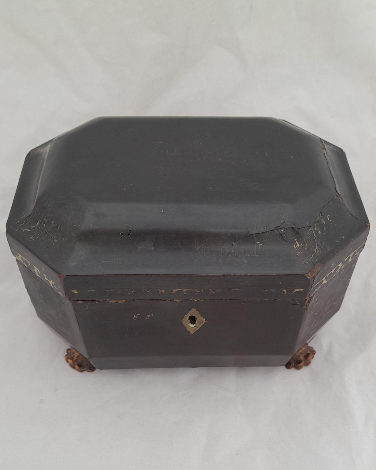 Antique Chinese Daoguang period Gilt and Black Lacquer rectangular with canted corners Tea Chest. The lidded chest stands on four lion paw feet and has two internal Paktong or pewter Tea canisters or Caddies with lids and covers. This item dates to the mid 19th Century circa 1840.