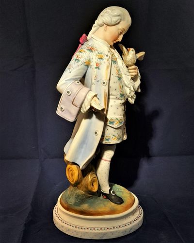 An antique French Old Paris enamelled bisque porcelain figurine young man with a dove on an oval faux marble base circa 1880 - 37 cm high - 2.58 Kg Probably Chantilly