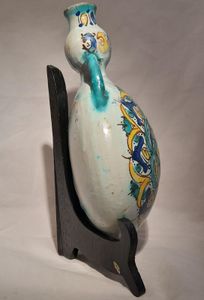 Moroccan tin glazed earthenware or faience pilgrim water flask antique 19th century hand painted with polychrome Arabesque foliate geometric pattern  727 grammes  9 inches long 6.5 inches wide  3 5/8 inches deep
