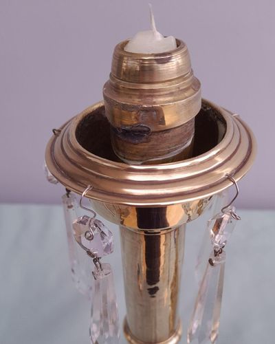 Pair of antique brass spring loaded hurricane candlesticks with grapevine etched glass shades with blue rim & cut glass prism lustre droppers 53 cm High 3.8 kg