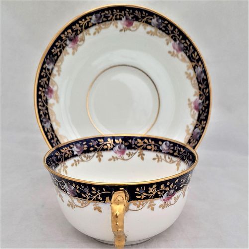 Handle view - Antique porcelain tea cup & saucer hand painted blue rim & swagged pink roses by W. Lambert 1915 - Larcombe King St Derby on a Bishop & Stonier Blank