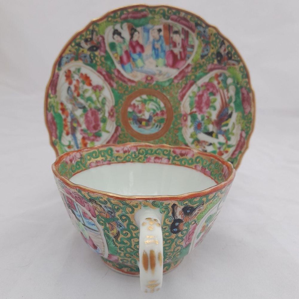 back or handle view of the cup  - saucer on a stand