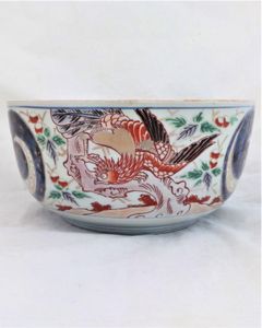An antique Japanese Arita porcelain bowl or tureen base decorated with hand painted Phoenix feng huang or Ho-Oo birds dating from the Edo period late 18th to early 19th century circa 1800 , 24 cm diameter.