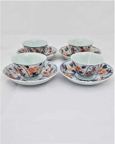 A very attractive set of four antique Japanese Arita porcelain tea bowls and saucers hand painted in an Imari pattern and dating we believe from the 18th century around 1730 during the Edo period (1603 - 1867).