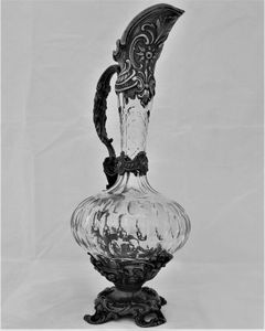 French ornate gothic scroll white metal mounted cut glass claret jug antique circa 1870 - shaft & globe shape decorated with thumb cuts & faceted neck 13 inches 1 1/2 pint capacity.