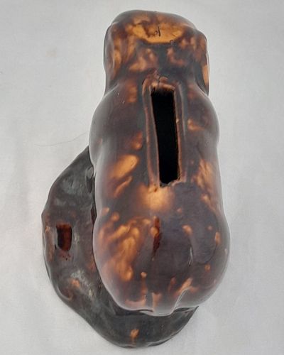 An antique novelty pottery elephant money box with a Rockingham type brown treacle glaze dates to the early 19th century - piggy bank in the form of a Jumbo elephant circa 1830 10. 3 cm high 12.6 cm long