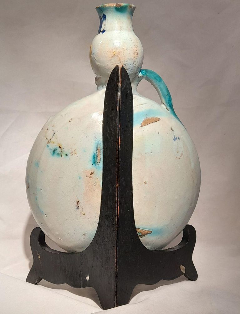 Moroccan tin glazed earthenware or faience pilgrim water flask antique 19th century hand painted with polychrome Arabesque foliate geometric pattern  727 grammes  9 inches long 6.5 inches wide  3 5/8 inches deep