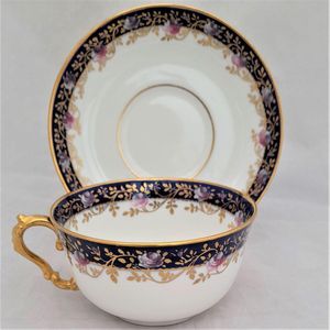 left image - Antique porcelain tea cup & saucer hand painted blue rim & swagged pink roses by W. Lambert 1915 - Larcombe King St Derby on a Bishop & Stonier Blank
