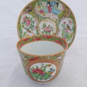Cup opposite handle with saucer on a stand