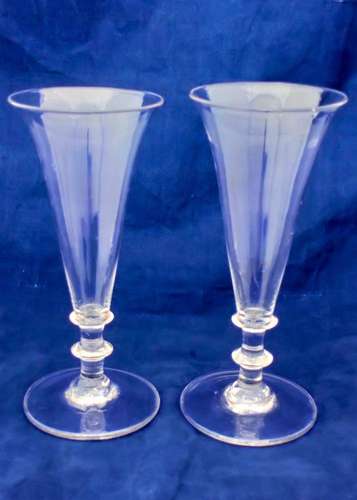Pair antique Regency period dwarf ale glasses with plain drawn trumpet bowl and twin blade knop stem plain foot with a rough pontil mark circa 1820