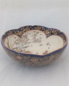 Small antique Japanese Satsuma pottery bowl with cobalt blue glaze and gilded decoration with a central hand painted Samurai warrior scene . Marked 宝山 Hozan Meiji period circa 1900.