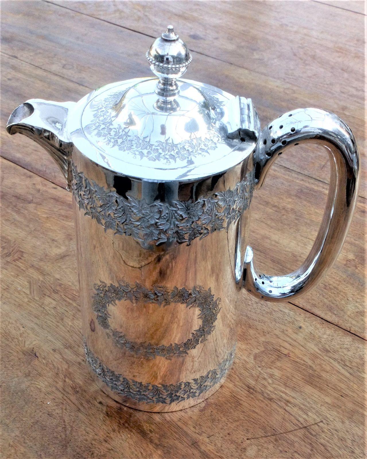 An antique Walker and Hall Victorian silver plated hot water jug or coffee pot engraved tapered cylindrical body innovative handle patent number 19759 cica 1900
