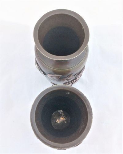 A pair of antique Japanese patinated bronze vases decorated with applied mixed metal birds and peony flowers made in the Meiji period circa 1900.  each 6 inches high and 2.5 inches diameter.