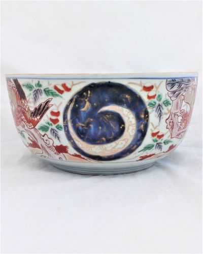 An antique Japanese Arita porcelain bowl or tureen base decorated with hand painted Phoenix feng huang or Ho-Oo birds dating from the Edo period late 18th to early 19th century circa 1800 , 24 cm diameter.