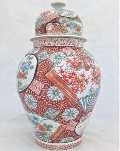 A large antique Japanese Hizen porcelain vase and cover marked Zoshuntei Saiho. Decorated in hand painted enamels with two large Japanese folding fans each painted with a colourful Asiatic Pheasant flying over a Japanese Acer.  This antique temple vase and cover dates from the mid 19th century circa 1860.