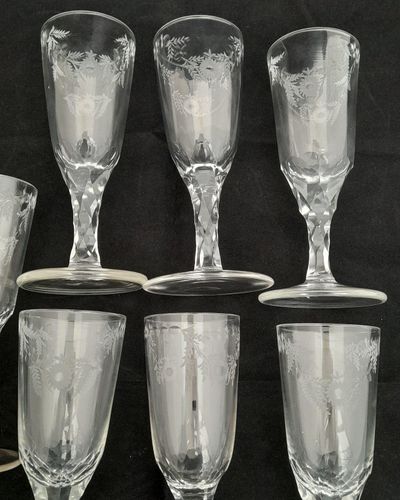 Antique set of seven Georgian style tall round funnel bowl flutes on diamond faceted stems and plain feet. The bowls wheel engraved with OXO and floral swags. Antique Ale Glasses or Champagne Flutes circa 1890