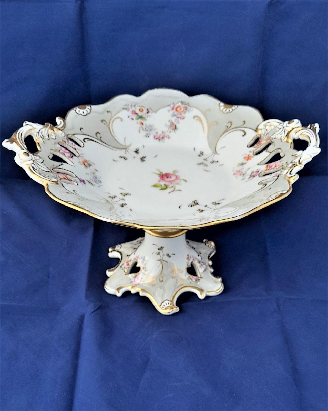 an antique large John Ridgway and Co porcelain comport shaped and pierced in a rococo revival style printed and hand painted in pattern number 5836 circa 1840