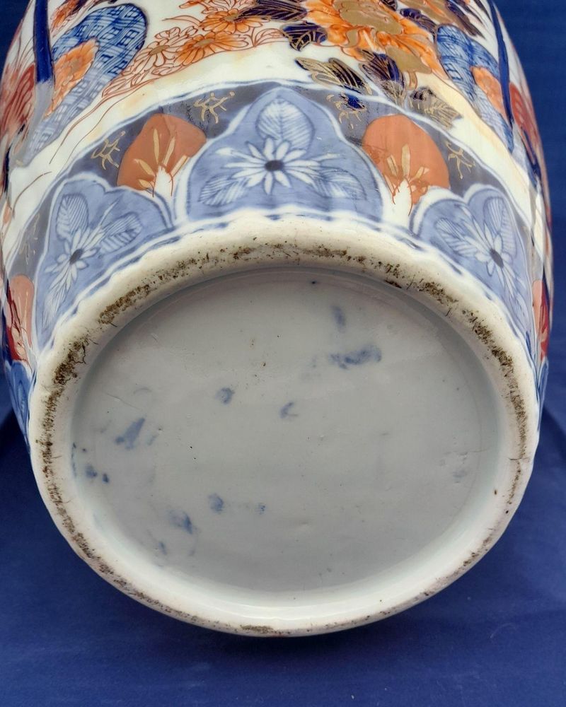 A large, 42.8 cm, Japanese Arita or Imari export porcelain baluster shaped vase with a ribbed body and flared trumpet neck, dating from the Meiji period in the latter half of the 19th century.