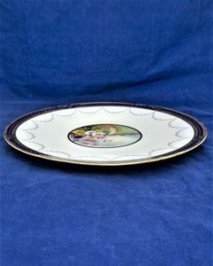 An antique Edwardian Spode Copeland's China porcelain cabinet plate painted central floral landscape pattern R2331 with daisy type flowers and topiary - gilded Bradford border registered design number 461740 antique circa 1905